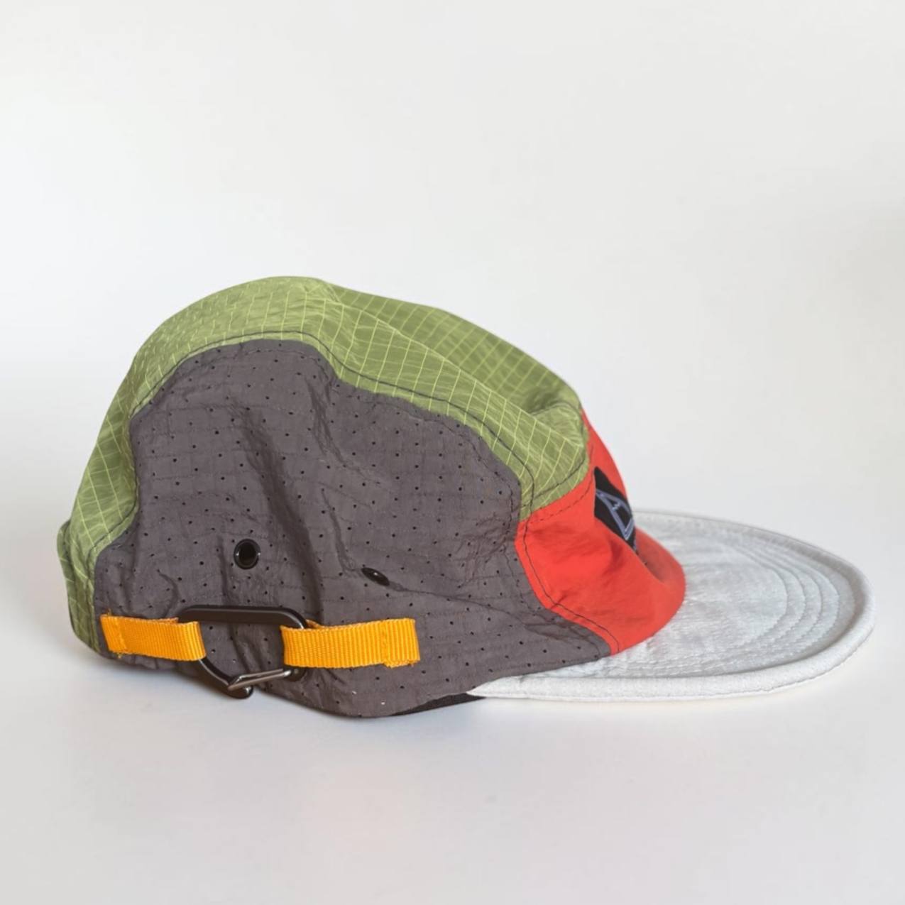 Outsiders technical route cap in green, grey and orange