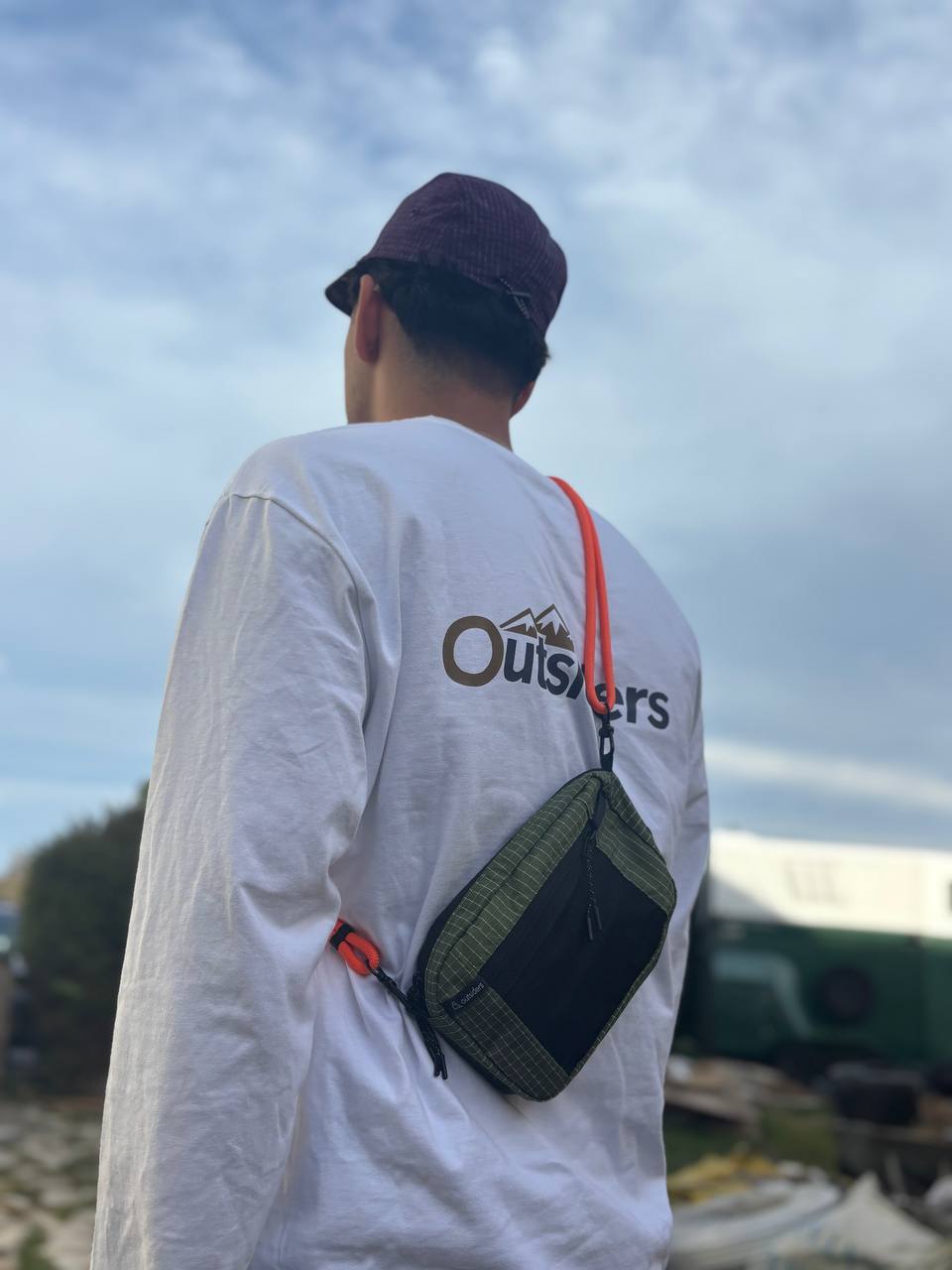 Outsiders green Mod bag worn crossbody outdoors
