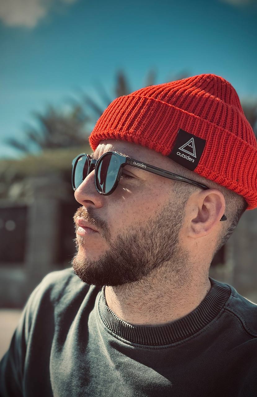 Outsiders orange beanie sunglasses hero
